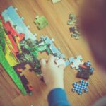 boy playing puzzle