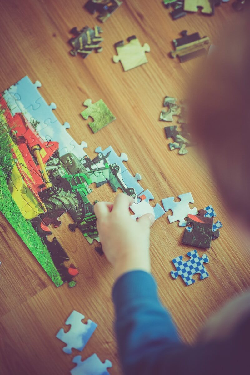 boy playing puzzle
